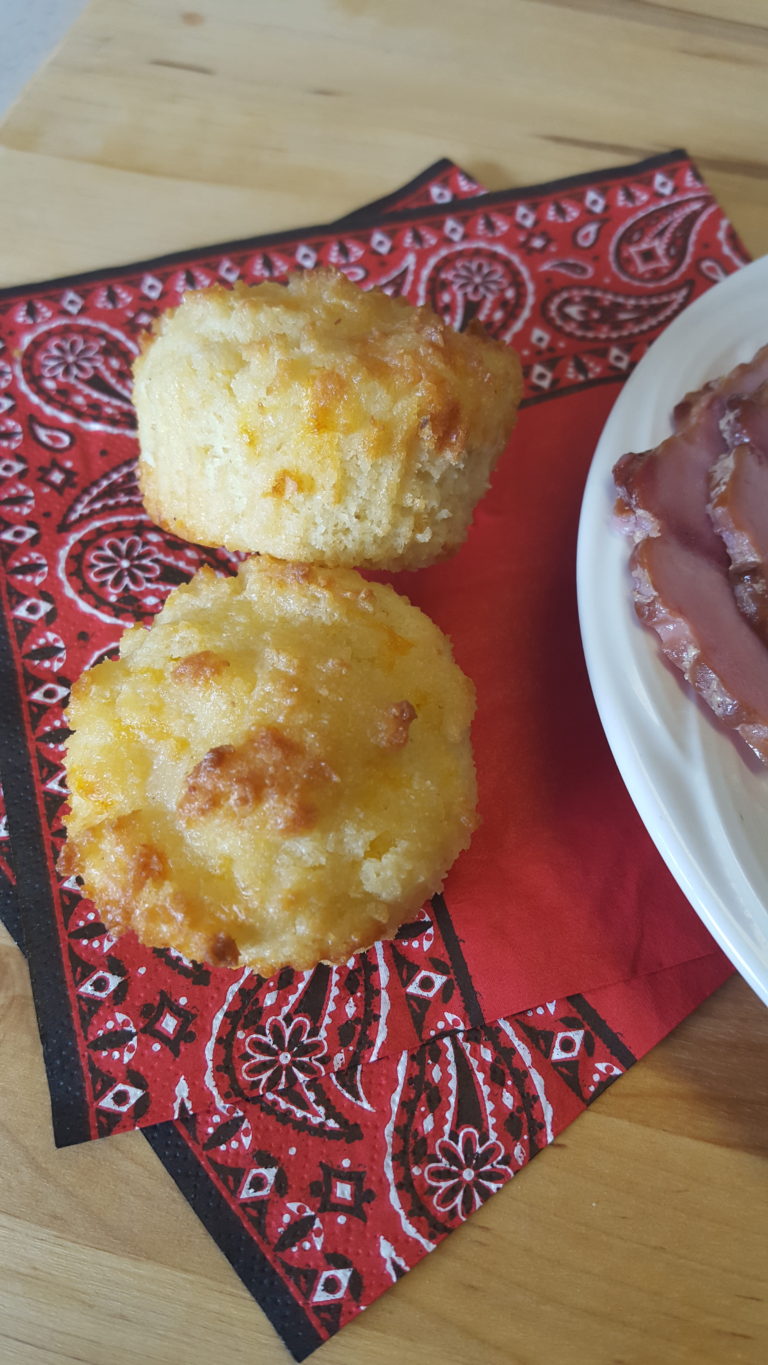 2 Keto cheddar garlic biscuits on a red napkin