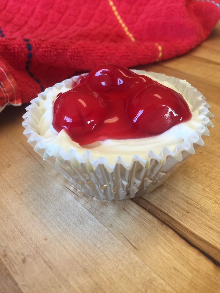 keto cherry cupcake in a silver cupcake tin on a table