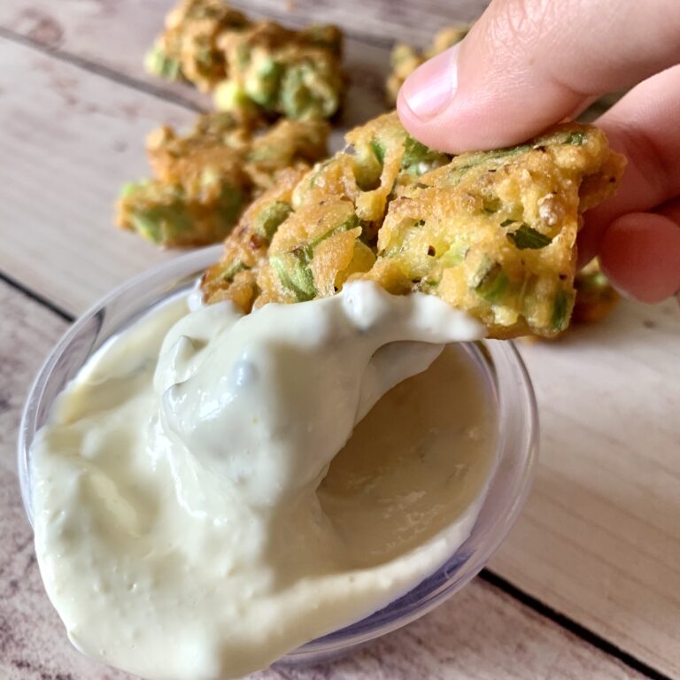 fried okra fritter dipped in tarter sauce