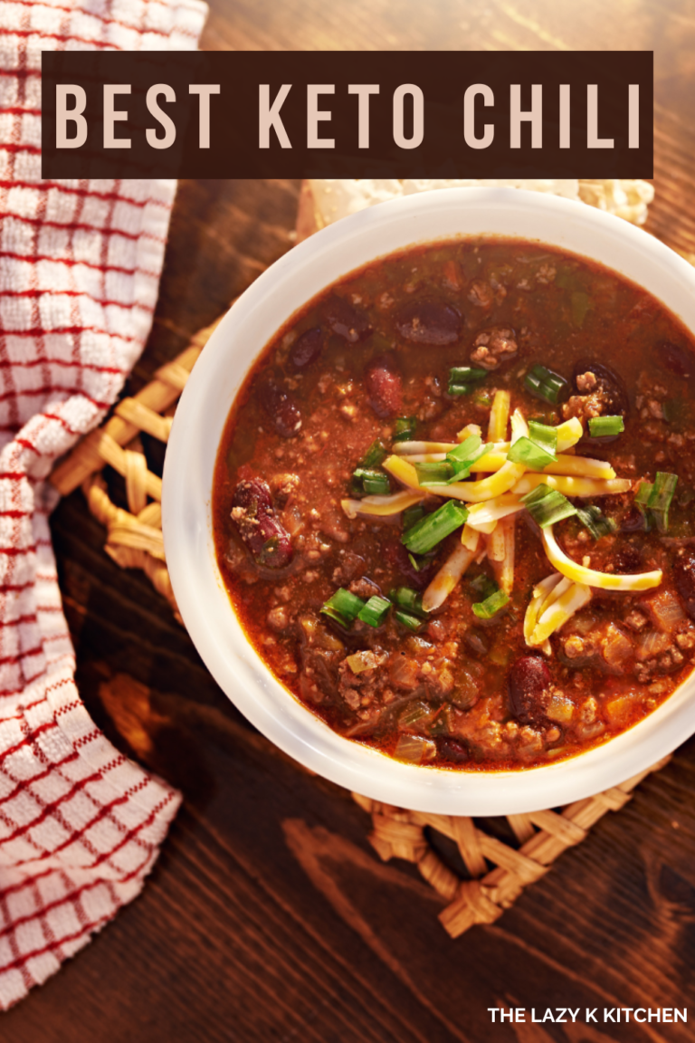 best keto chili in a white bowl on a brown table with a checkered hand towel