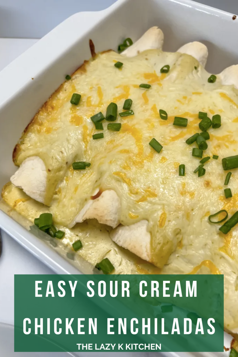 sour cream chicken enchiladas in a white baking dish