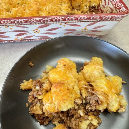 manwich tater tot casserole on a black plate