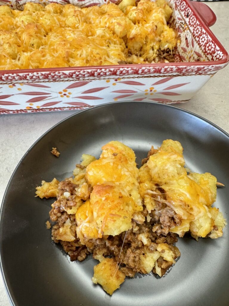 manwich tater tot casserole on a black plate