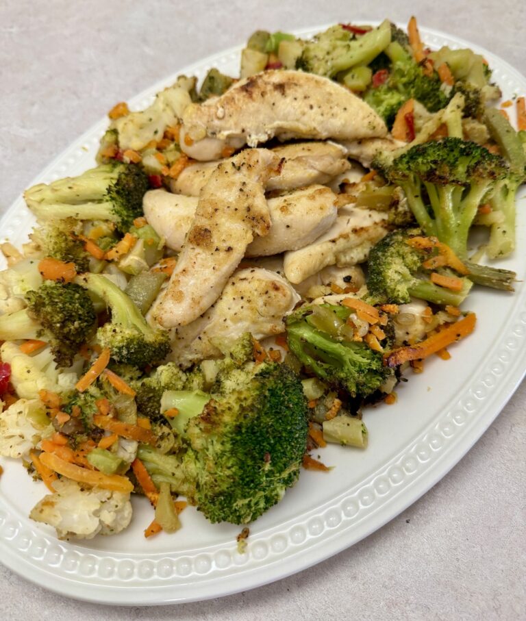 chicken and vegetables on a white plate