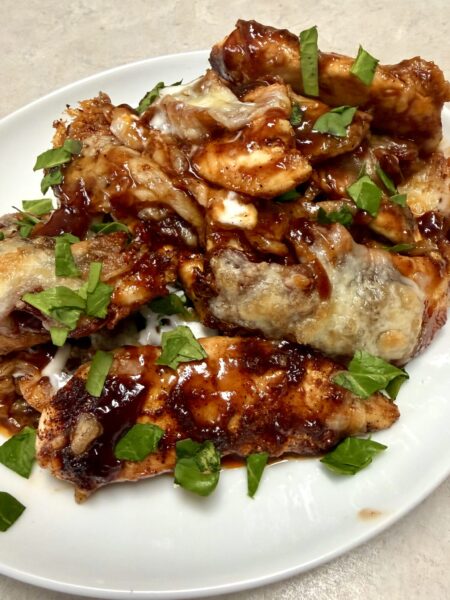BBQ chicken on a white plate