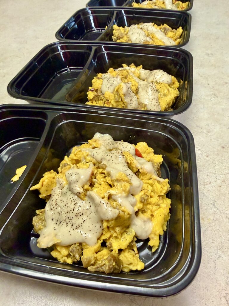 meal prepped bowls of scrambled egg breakfast bowls