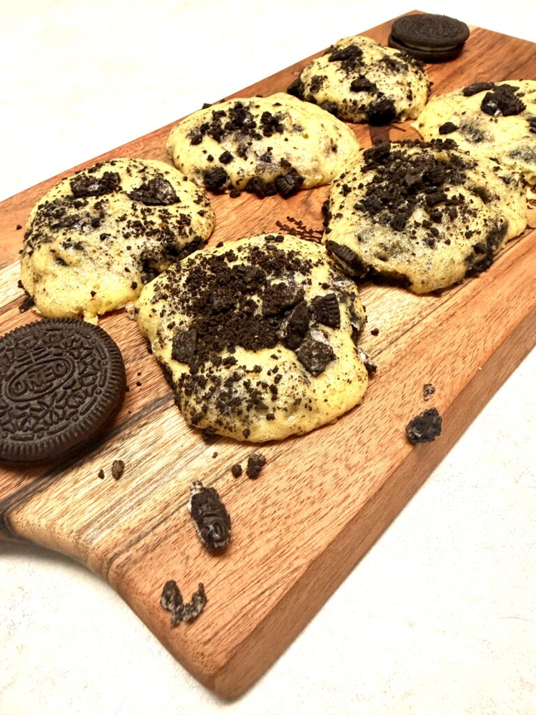 Oreo cookies on a brown cutting board