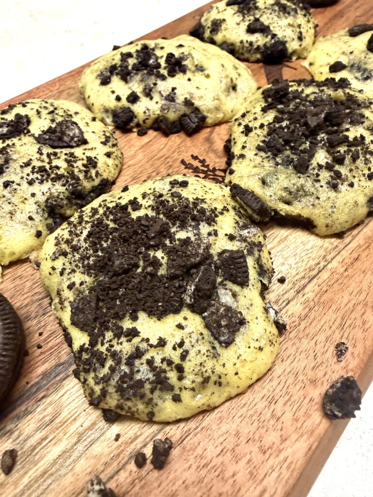 Oreo cookies on a brown cutting board