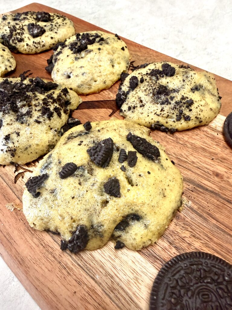 Oreo cookies on a brown cutting board