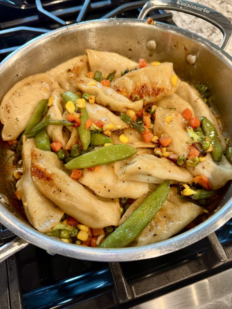 Skillet of potstickers and veggies