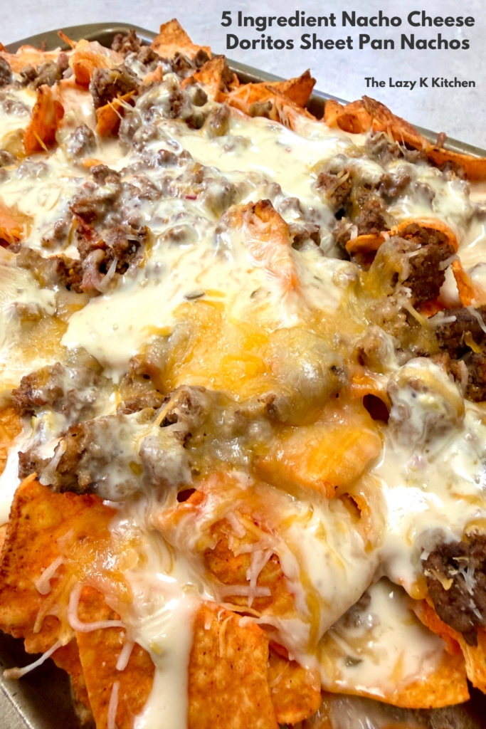 Pinterest Picture of sheet pan nachos on a baking sheet pan.