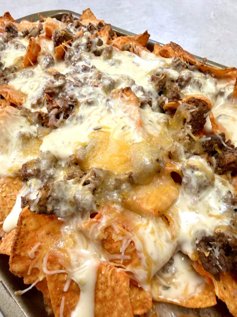 Picture of sheet pan nachos on a baking sheet pan.