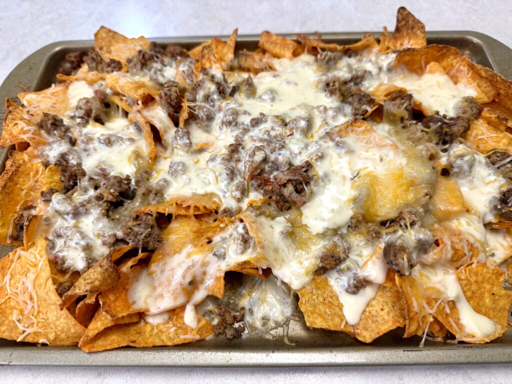 Picture of sheet pan nachos on a baking sheet pan.
