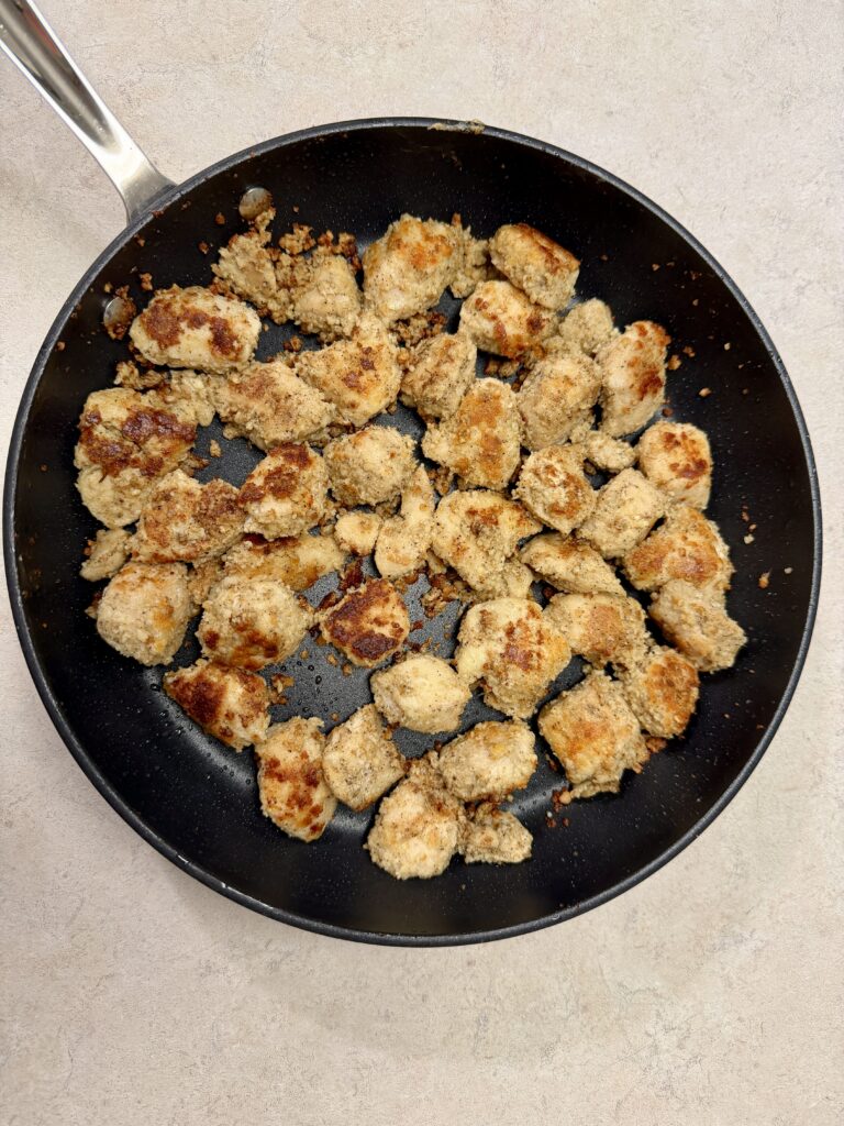 Picture of garlic parmesan chicken bites in a skillet.