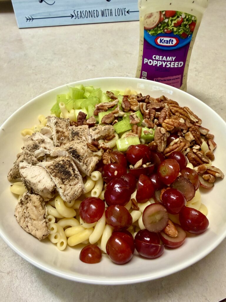 Picture of poppyseed chicken salad in a white bowl.