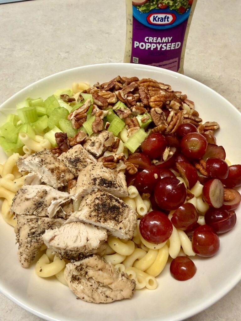 Picture of poppyseed chicken salad in a white bowl.