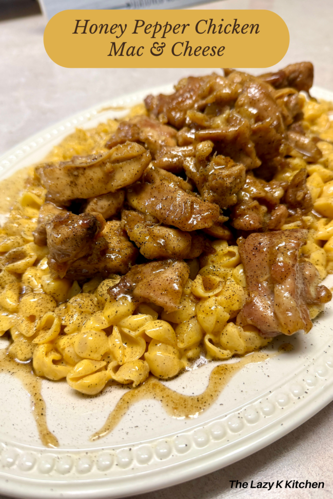 Pinterest Picture of honey pepper chicken mac and cheese on a white platter.