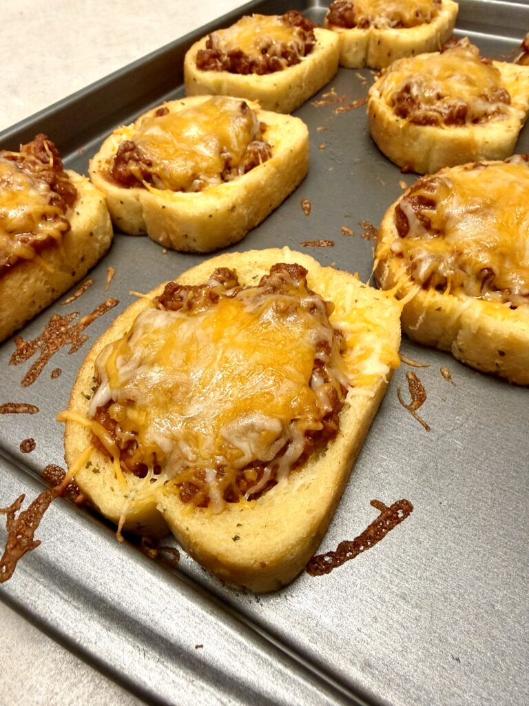 Picture of 4 ingredient Texas toast sloppy joes on a baking sheet pan.
