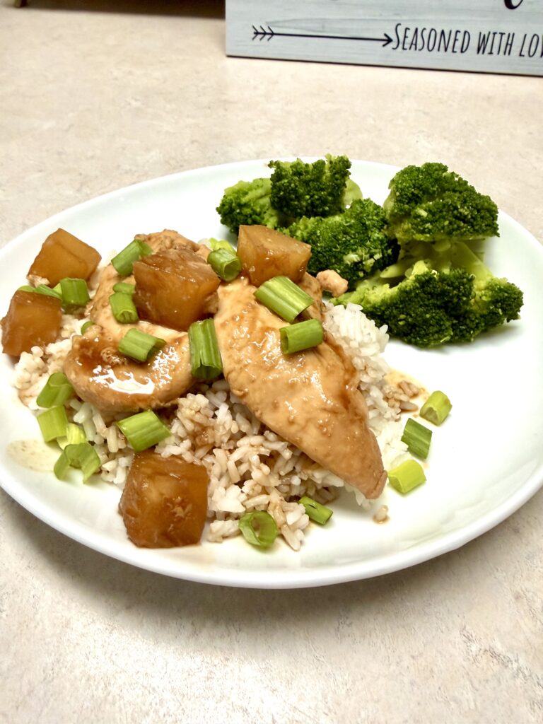 plate of teriyaki chicken over white rice and broccoli