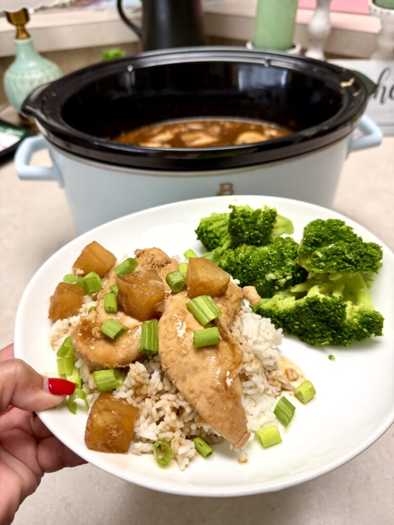 chicken teriyaki and broccoli on a white plate and chicken in a crockpot