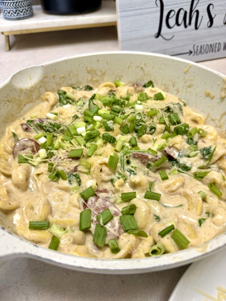 smoked sausage tortellini in a white skillet