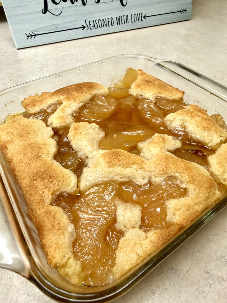apple pie cobbler in a clear 9x9 pan