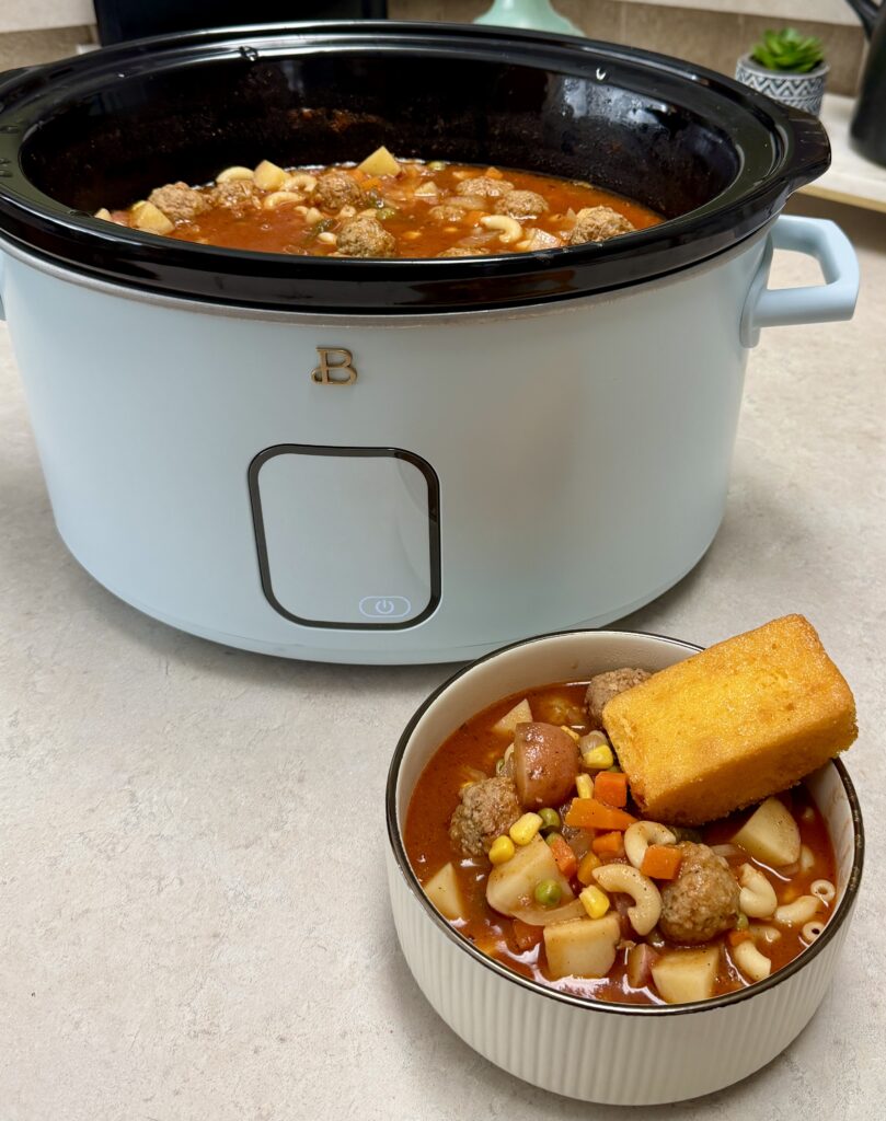 meatball stew in a crockpot and bowl