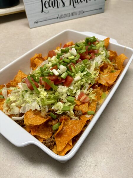 walking taco in a white baking dish