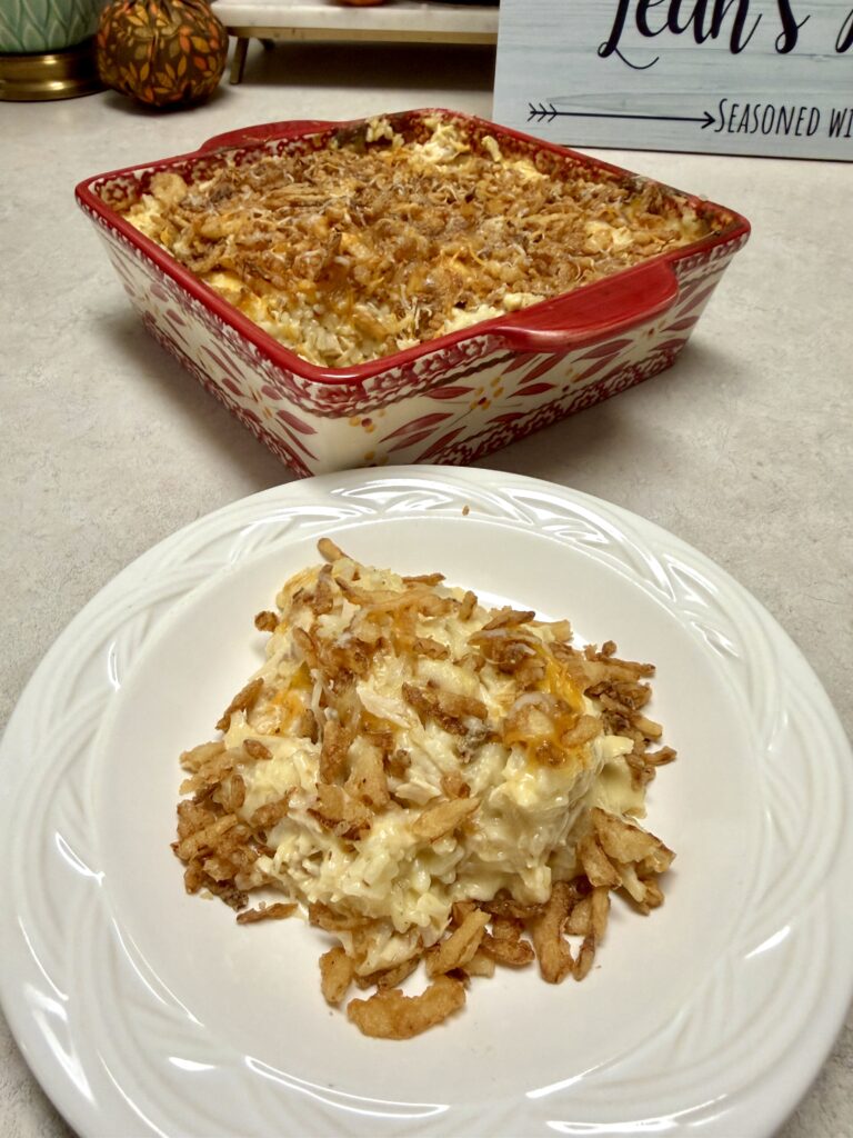 chicken casserole on a white plate and in a red baking dish