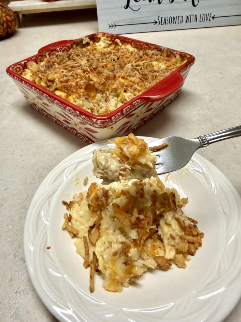 casserole on a white plate and a bite on a fork