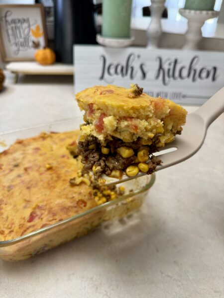 taco cornbread bake with a slice on a spatula