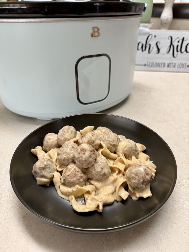 meatballs and noodles on a black plate