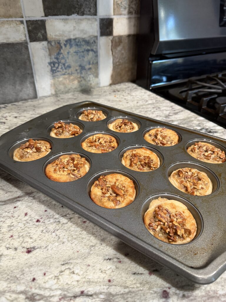 pecan pie tarts in a muffin pan